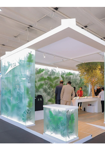 The RTA COP28 stand by Studio Königshausen in Dubai boasts an avant-garde design, featuring illuminated walls adorned with lush greenery, shaping an interactive, futuristic city model.